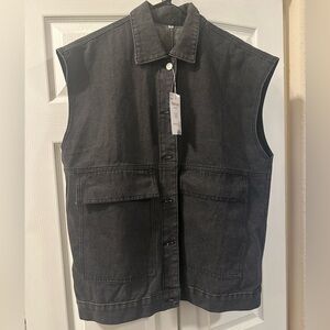 Black sleeveless jean jacket.
